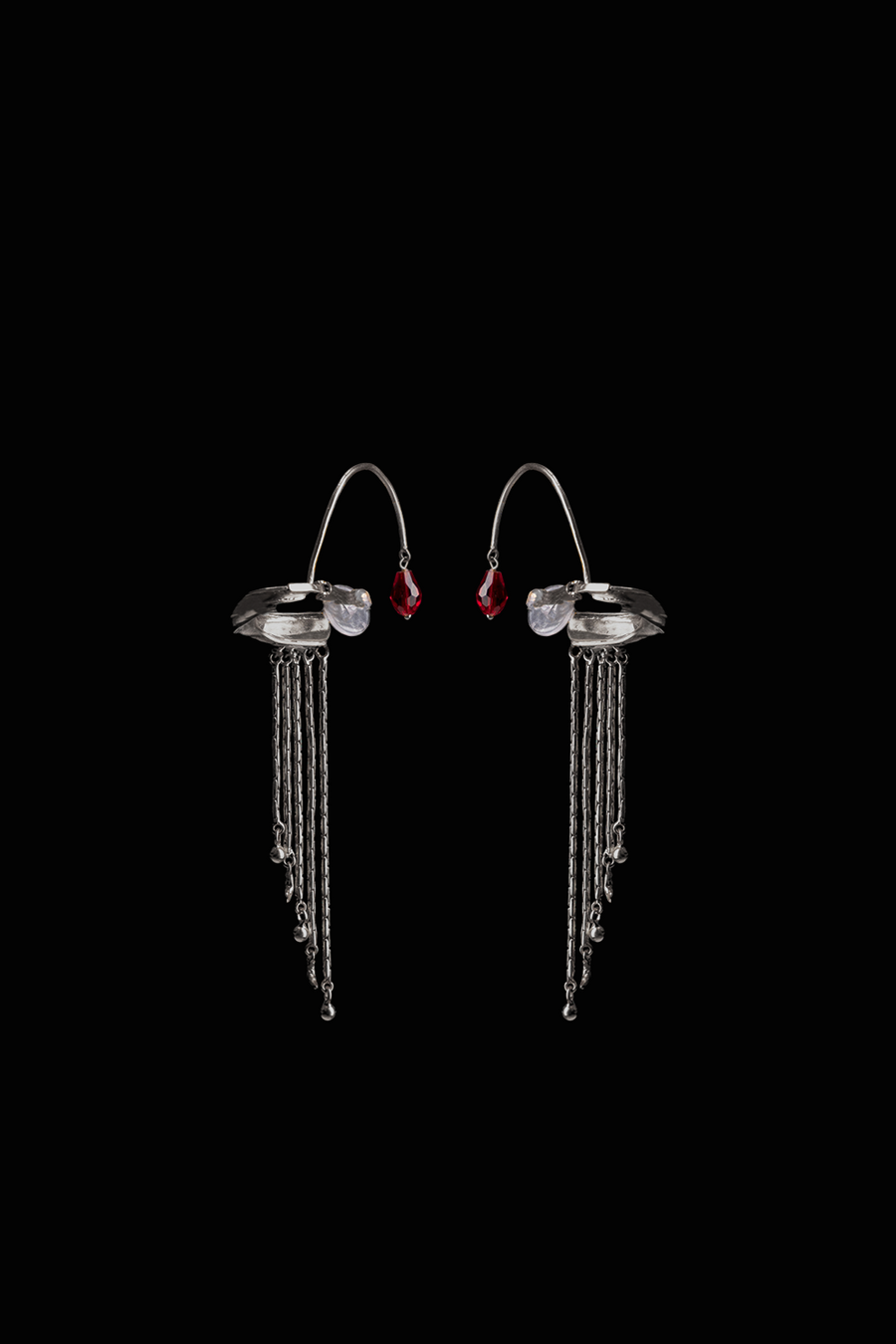 Embrace Earclip in sterling silver, product photo on black – ear clips, Bhavya Ramesh