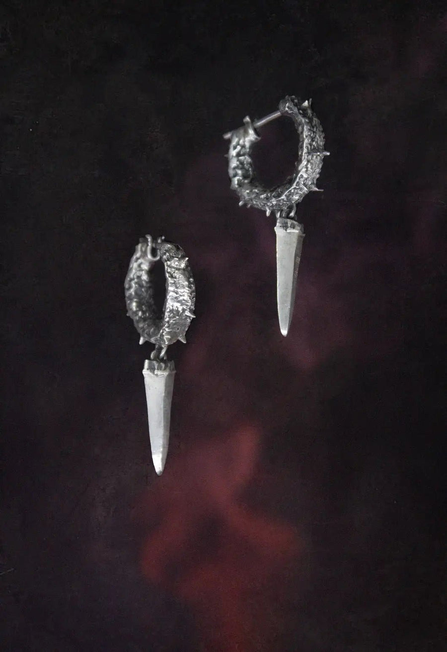 Anguished Earring in 925 sterling silver, product photo on black – earrings, Bhavya Ramesh