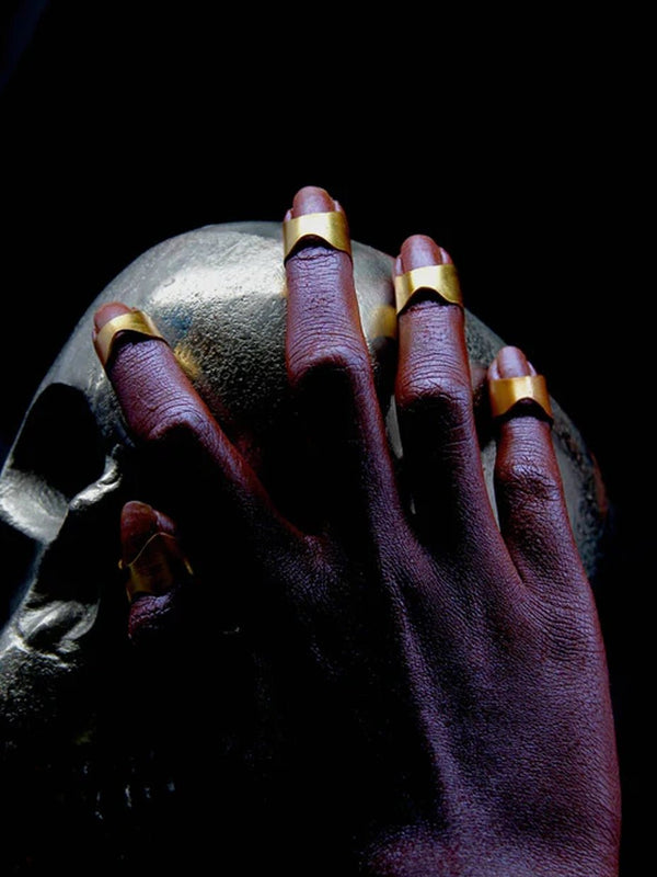 Armour Nail Rings in 18-carat gold plating on sterling silver, product photo on black – nail rings, Bhavya Ramesh