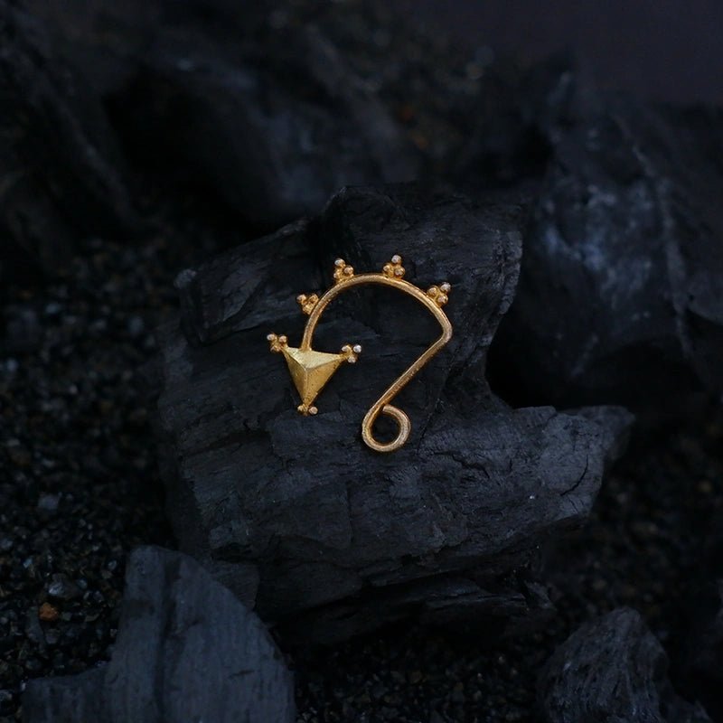 Arrow Nose Clip in 18-carat gold plating on sterling silver, product photo on black – nose pin, Bhavya Ramesh