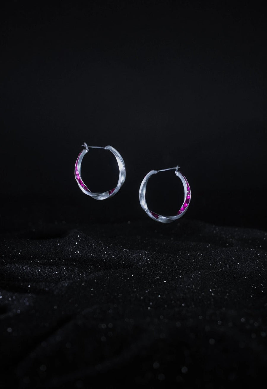 Astika Earring in 925 sterling silver, product photo on black – earrings, Bhavya Ramesh
