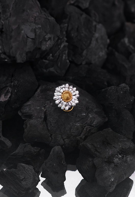Banjara Nose Pin in 18-carat gold plating on sterling silver, product photo on black – nose pin, Bhavya Ramesh
