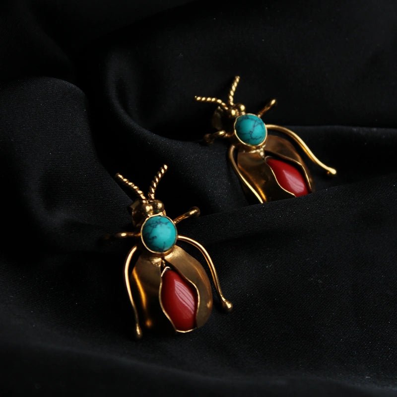 Bug Brooch in 18-carat gold plating on sterling silver, product photo on black – brooch, Bhavya Ramesh