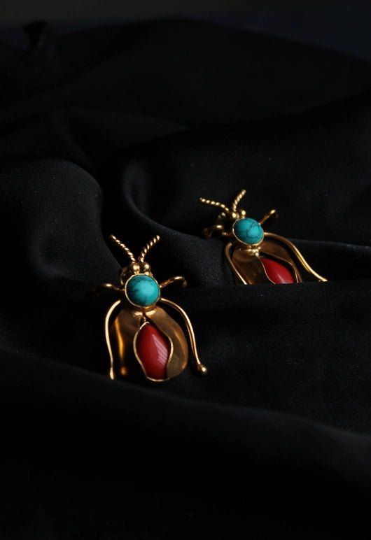 Bug Earrings in 18-carat gold plating on sterling silver, product photo on black – earrings, Bhavya Ramesh