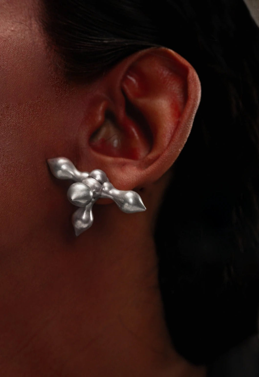Crucifix earring in 925 sterling silver, worn by a model – earrings, Bhavya Ramesh
