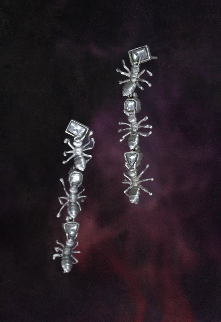Insidious Earring in 925 sterling silver, product photo on black – earrings, Bhavya Ramesh