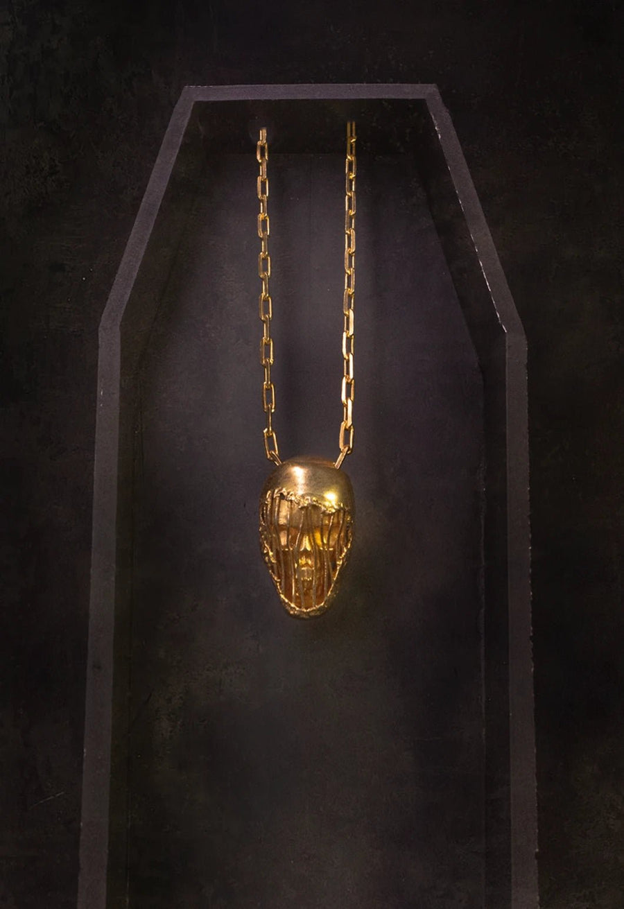 Iron grip neck piece in 18-carat gold plating on sterling silver, product photo on black – neck pieces, Bhavya Ramesh