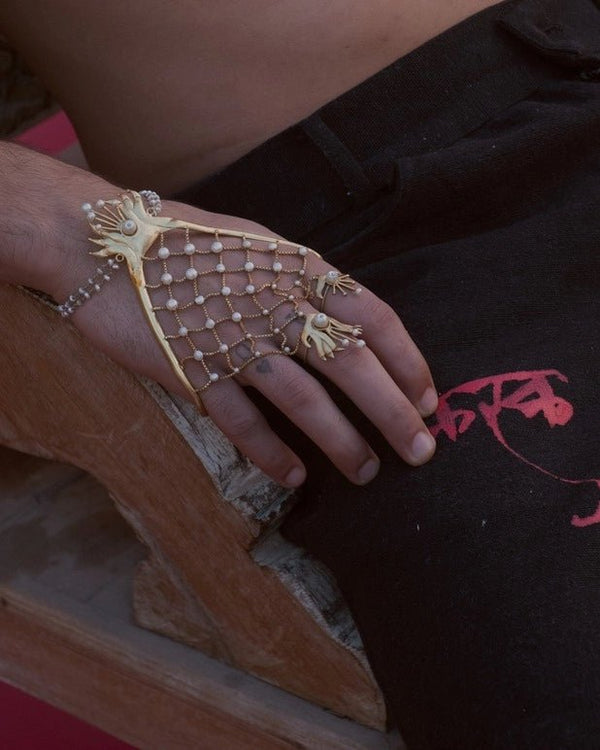 Kaju Katli in 18-carat gold plating on sterling silver, worn by a model – palm cuff, Bhavya Ramesh