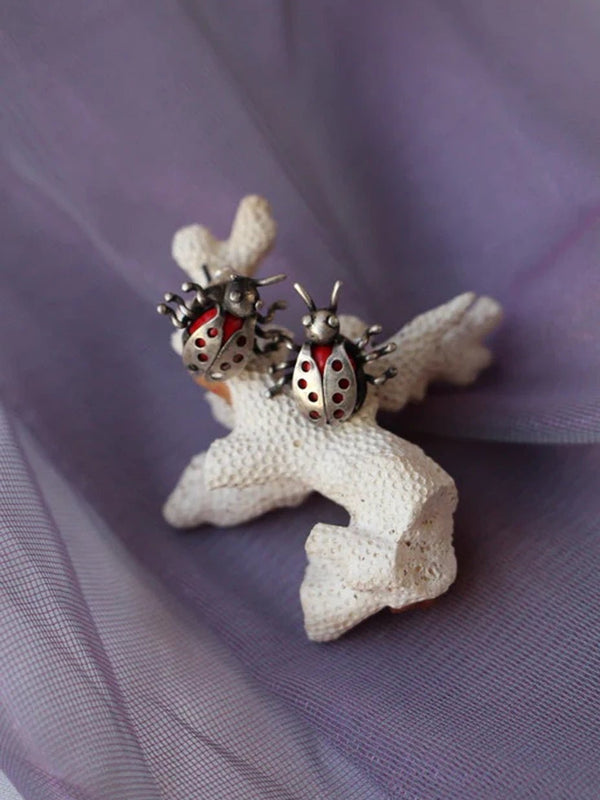 Lady Bug Earring in 925 sterling silver, product photo on black – earrings, Bhavya Ramesh