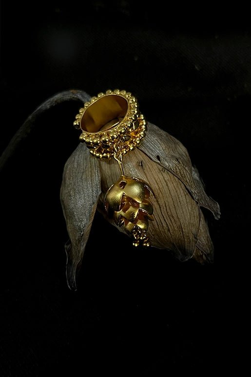 Lotus Ring in 18-carat gold plating on sterling silver, product photo on black – rings, Bhavya Ramesh