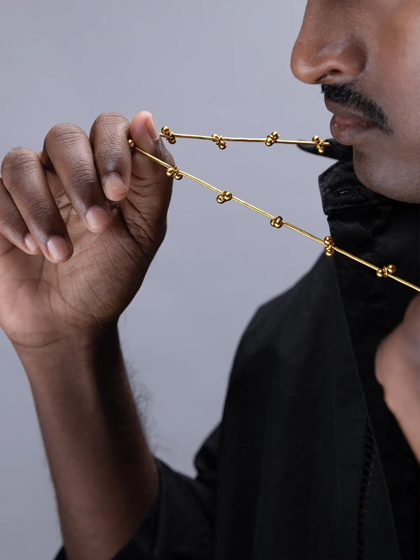 Mankashi Neckpiece in 18-carat gold plating on sterling silver, worn by a model – neck pieces, Bhavya Ramesh