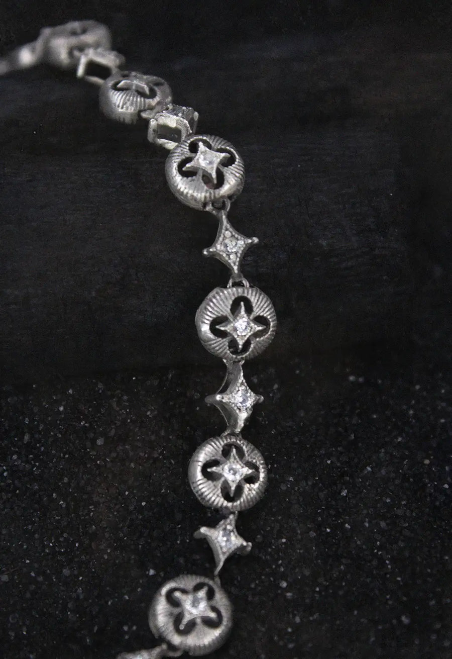 Oblivion Neckpiece in 925 sterling silver, product photo on black – neck pieces, Bhavya Ramesh