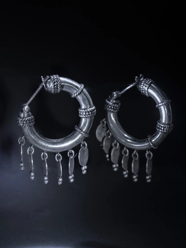 ShimmerShield Hoops in 925 sterling silver, product photo on black – earrings, Bhavya Ramesh