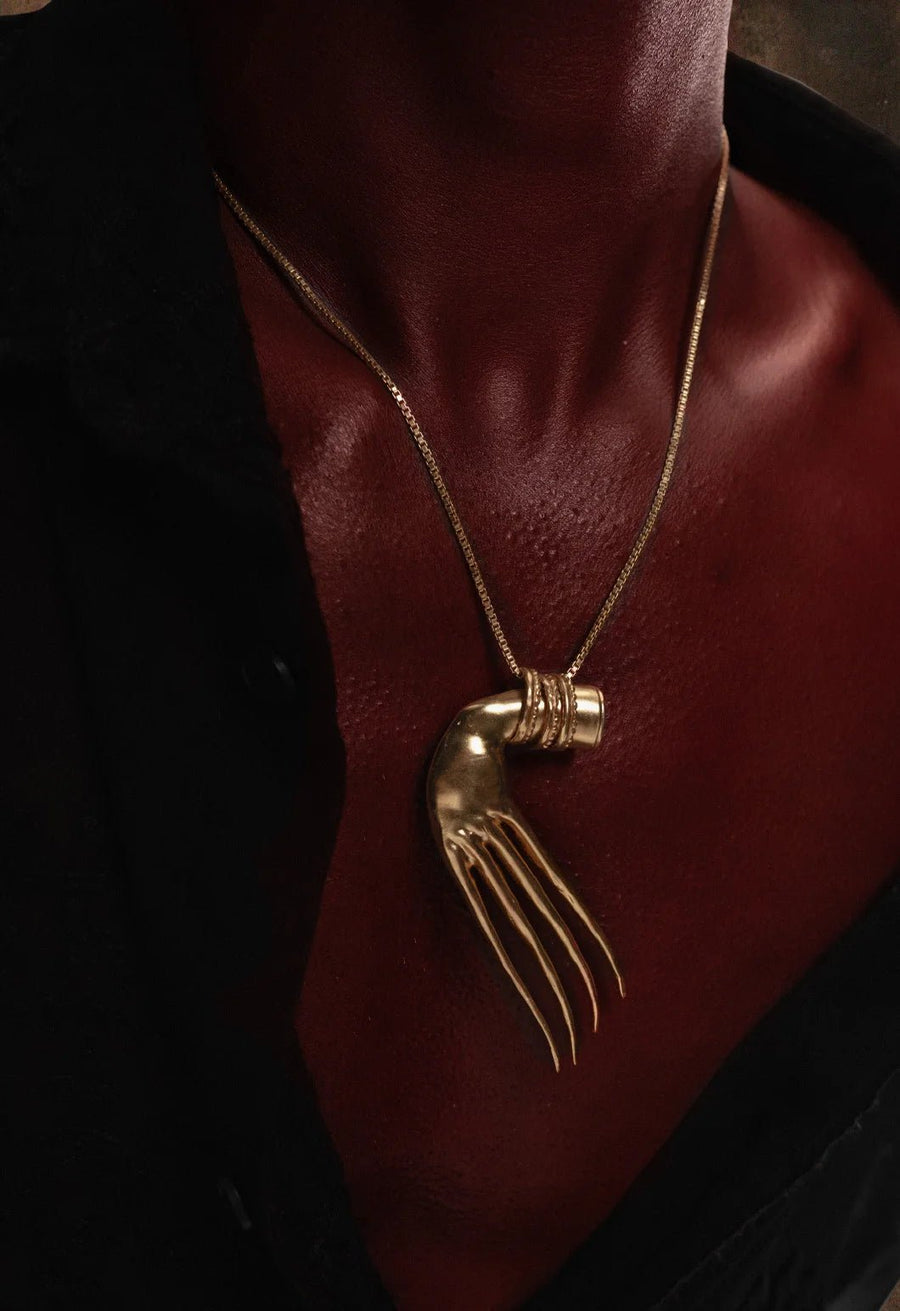 Soul snatcher Neckpiece in 18-carat gold plating on sterling silver, product photo on black – neck pieces, Bhavya Ramesh
