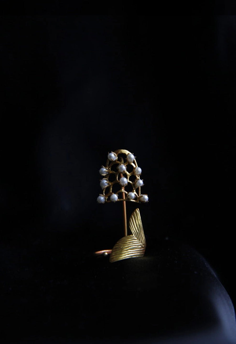 The Pearler in 18-carat gold plating on sterling silver, product photo on black – nail rings, Bhavya Ramesh