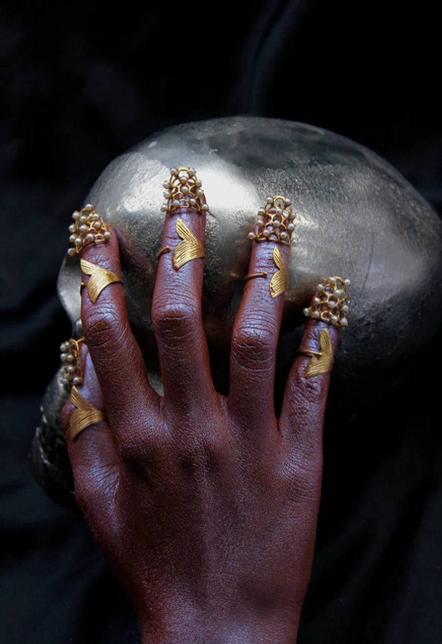 The Pearler in 18-carat gold plating on sterling silver, product photo on black – nail rings, Bhavya Ramesh