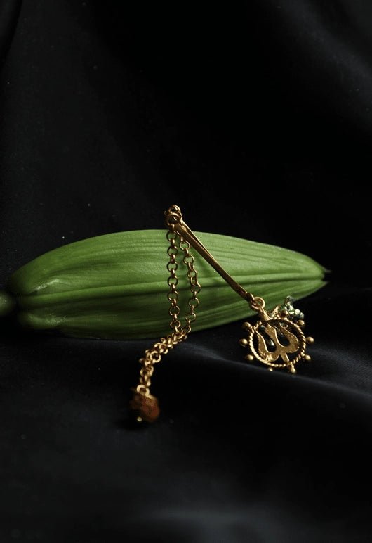 Trishul & Rudraksh Ear Hang in 18-carat gold plating on sterling silver, product photo on black – ear clips, Bhavya Ramesh