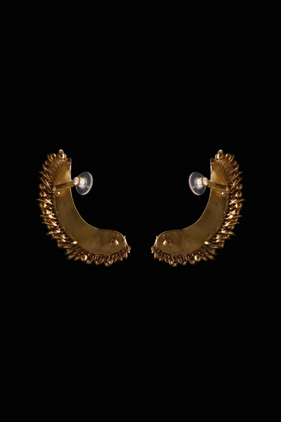 Tusk Earclips in sterling silver, product photo on black – ear clips, Bhavya Ramesh