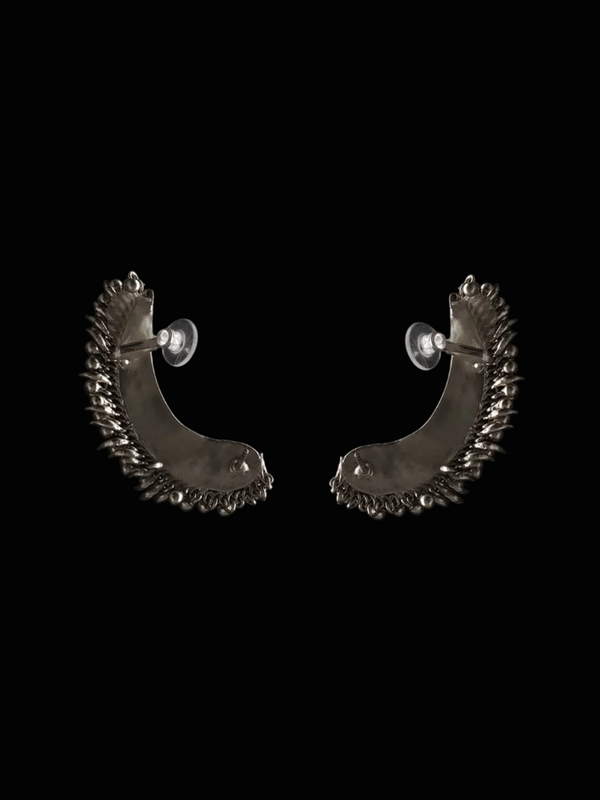 Tusk Earclips in sterling silver, product photo on black – ear clips, Bhavya Ramesh
