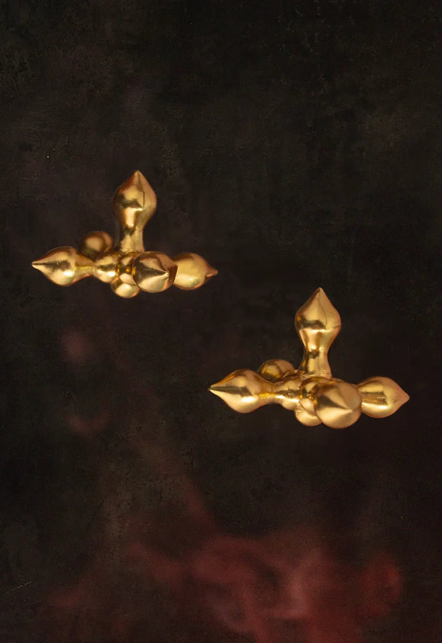 Crucifix earring in 18-carat gold plating on sterling silver, product photo on black – earrings, Bhavya Ramesh