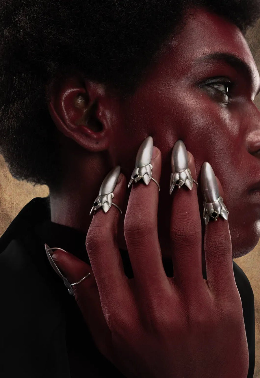 Devil Dagger Nail Ring in 925 sterling silver, product photo on black – nail rings, Bhavya Ramesh