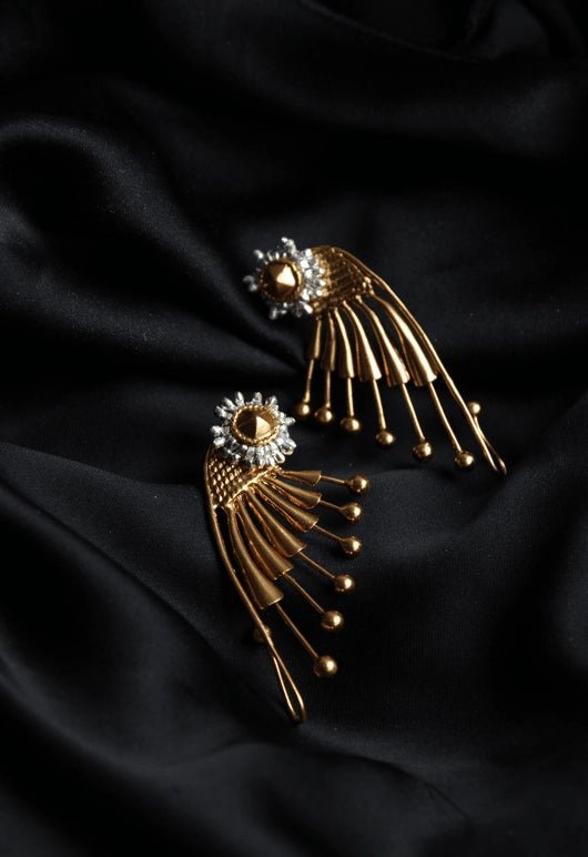 Ear Wing Earrings in 18-carat gold plating on sterling silver, product photo on black – earrings, Bhavya Ramesh