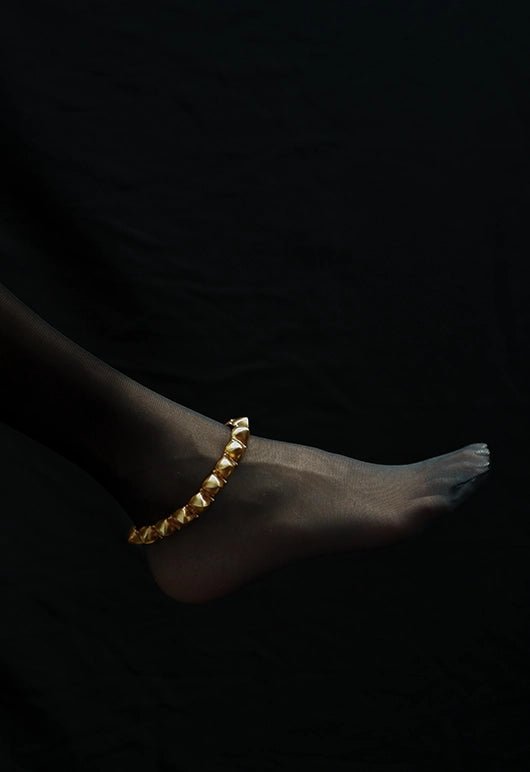 Edge Of Everything Anklet in 18-carat gold plating on sterling silver, product photo on black – anklet, Bhavya Ramesh