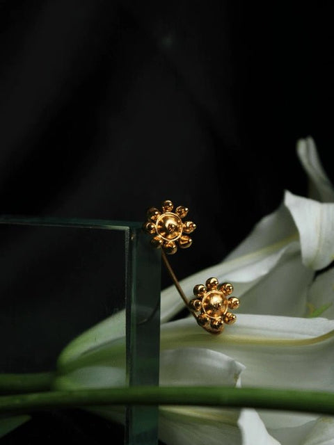 Flower Ear Clip in 18-carat gold plating on sterling silver, product photo on black – ear clips, Bhavya Ramesh