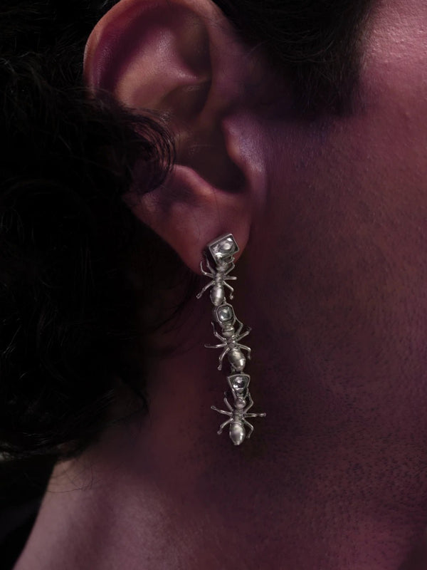 Insidious Earring in 925 sterling silver, product photo on black – earrings, Bhavya Ramesh