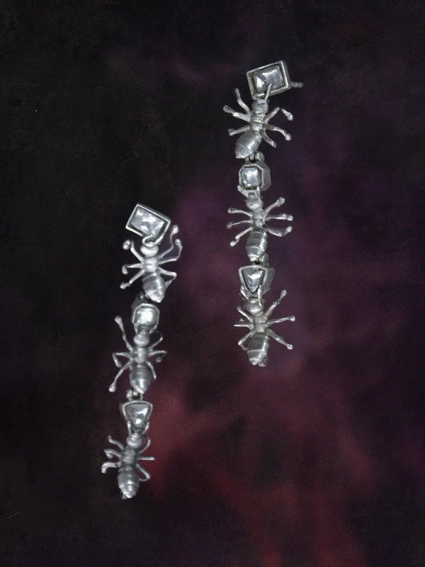 Insidious Earring in 925 sterling silver, product photo on black – earrings, Bhavya Ramesh