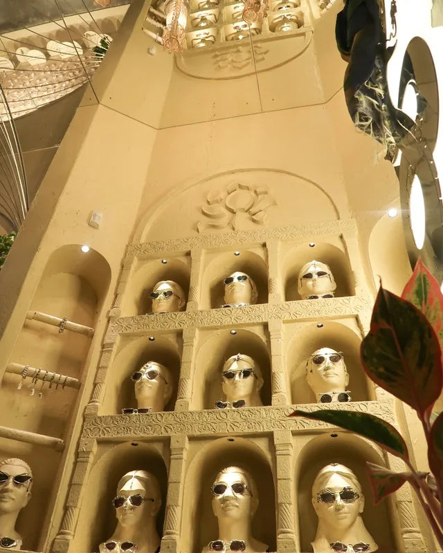 The reimagined wall of faces, each face wearing Bhavya Ramesh sunglasses