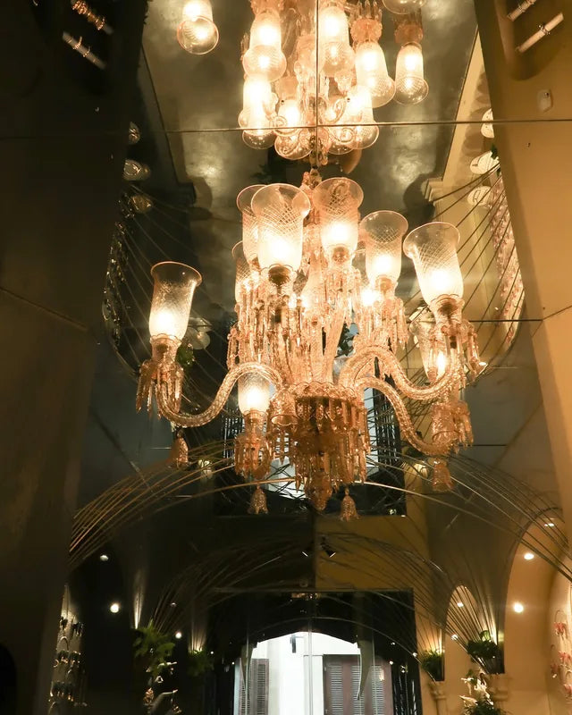 Chandelier and dark mirrored ceiling inside the Kala Ghoda store