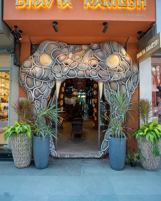 The cave-like serpent facade of the Khan Market store