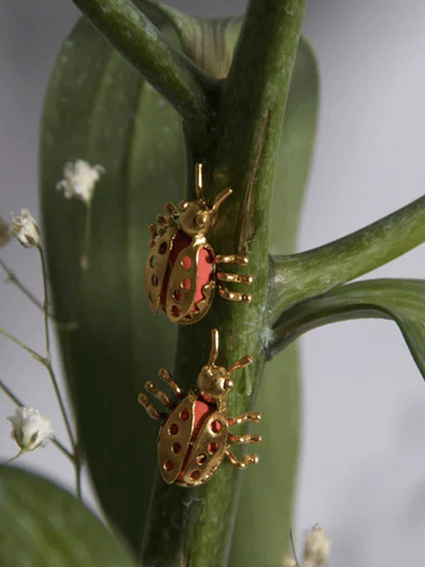 Lady Bug Earring in 18-carat gold plating on sterling silver, product photo on black – earrings, Bhavya Ramesh