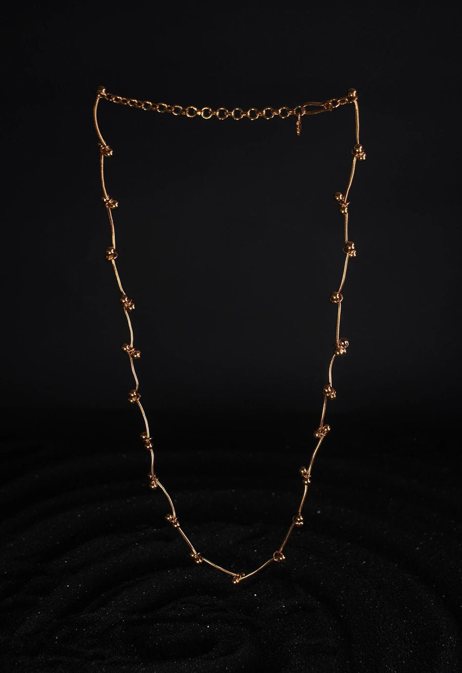 Mankashi Neckpiece in 18-carat gold plating on sterling silver, product photo on black – neck pieces, Bhavya Ramesh