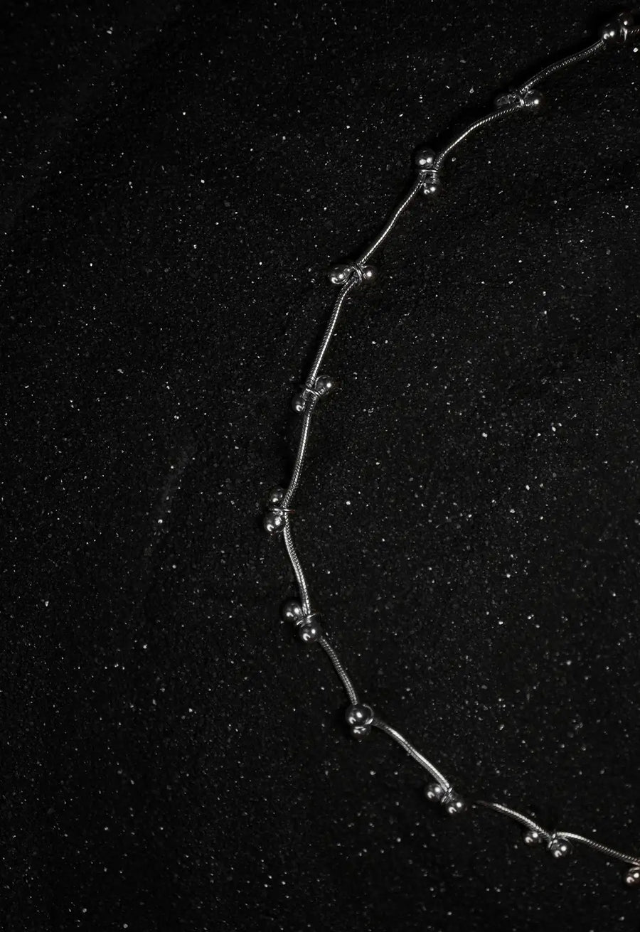 Mankashi Neckpiece in 925 sterling silver, product photo on black – neck pieces, Bhavya Ramesh