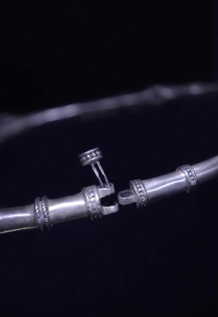 NityaNirvana in 925 sterling silver, product photo on black – neck pieces, Bhavya Ramesh