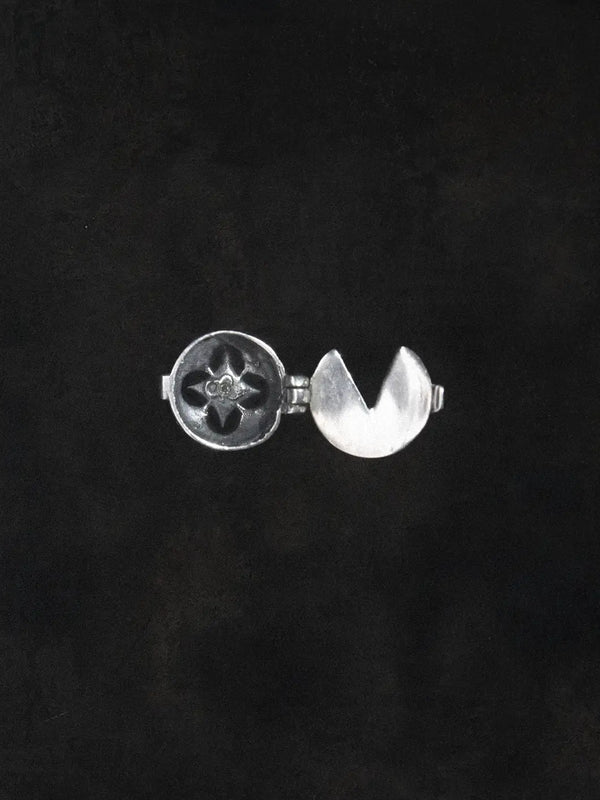 Oblivion Button Top in 925 sterling silver, product photo on black – wrist wear, Bhavya Ramesh