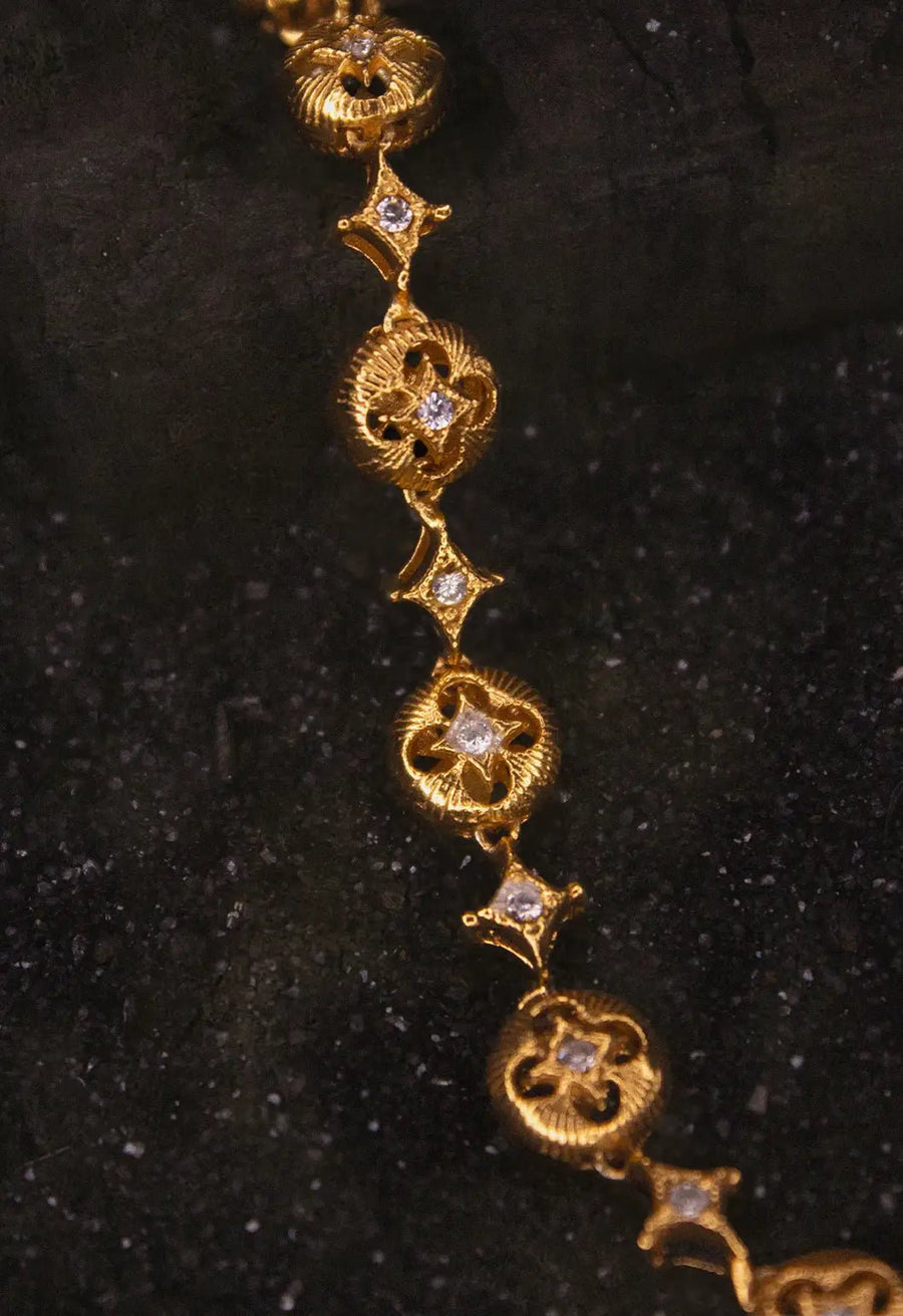 Oblivion Neckpiece in 18-carat gold plating on sterling silver, product photo on black – neck pieces, Bhavya Ramesh