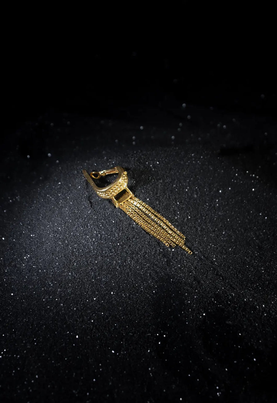 Slinther Ear clips in 18-carat gold plating on sterling silver, product photo on black – ear clips, Bhavya Ramesh