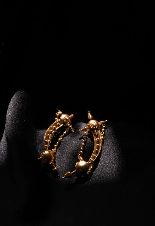 Sword Ear Cuff in 18-carat gold plating on sterling silver, product photo on black – earrings, Bhavya Ramesh