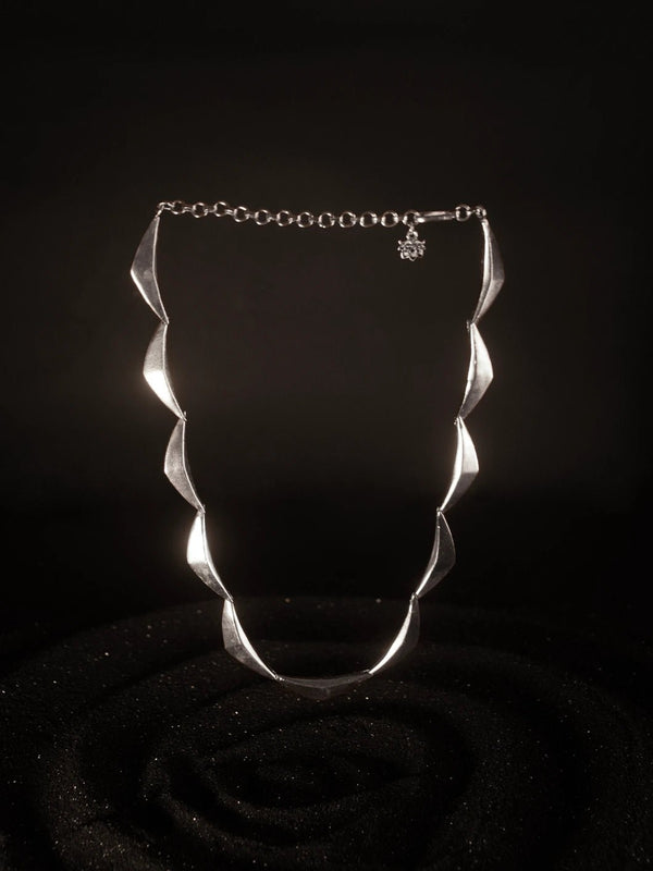 Vegavat Neckpiece in 925 sterling silver, product photo on black – neck pieces, Bhavya Ramesh