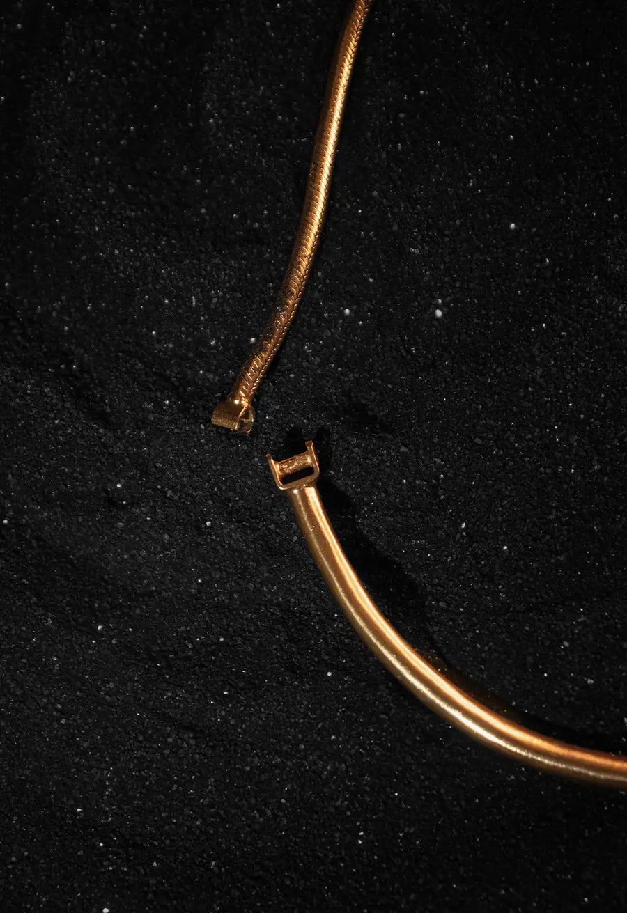 Vishrantha Neckpiece in 18-carat gold plating on sterling silver, product photo on black – neck pieces, Bhavya Ramesh
