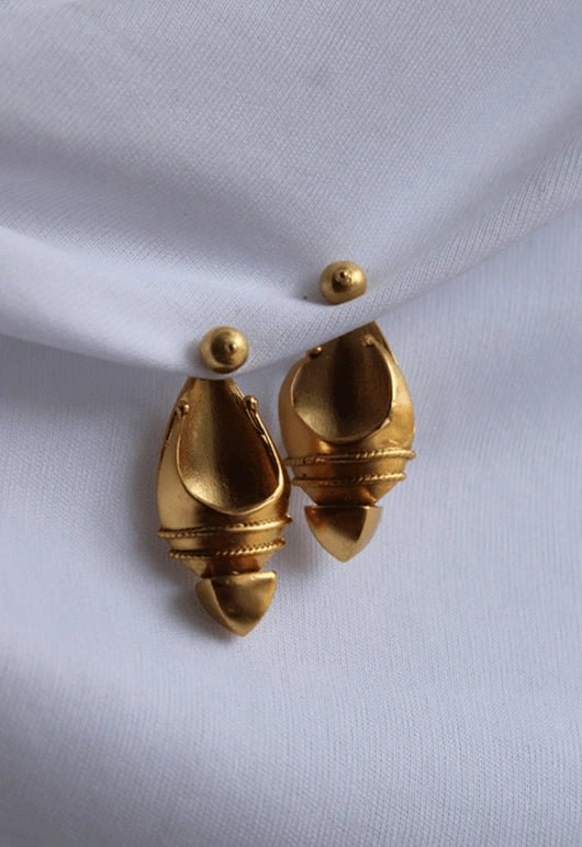 Warrior Of Light Ear Shields in 18-carat gold plating on sterling silver, product photo on black – earrings, Bhavya Ramesh