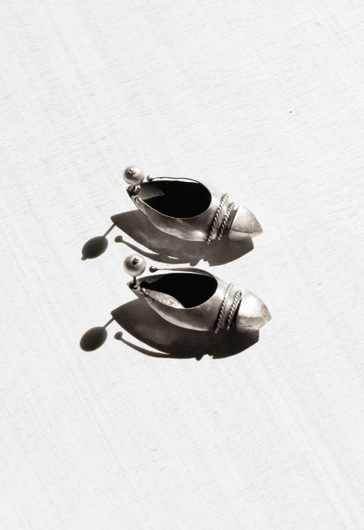 Warrior Of Light Ear Shields in 925 sterling silver, product photo on black – earrings, Bhavya Ramesh